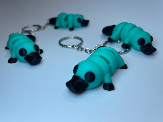 Beweglicher Schnabeltier Schlüsselanhänger Dexter in Türkis und Schwarz