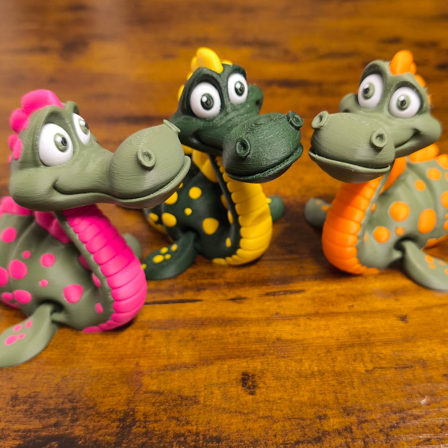 Lochness Monster in 3 Farben. Magenta, Orange, Gelb. 3D-Druck