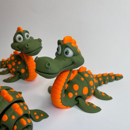 Mehrere 3D-gedruckte Flexi Figuren Günter – das freundliche Loch Ness Monster aus PLA, gefertigt von 3DruckAS