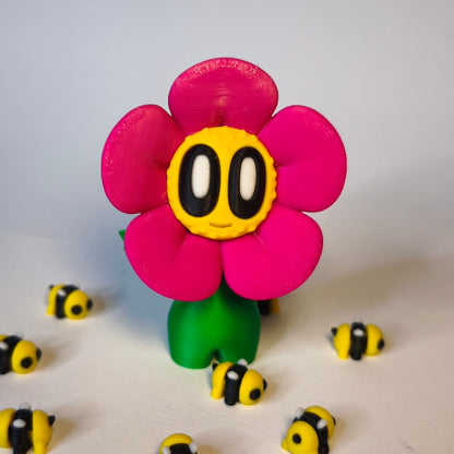 3D-gedruckte Blume ‚Daisy‘ mit Gesicht im Gänseblümchen-Stil in magenta als Dekofigur