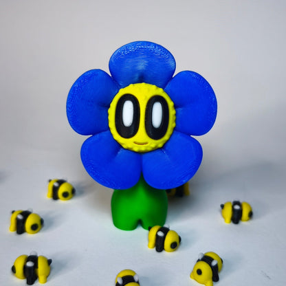 3D-gedruckte Blume ‚Daisy‘ mit Gesicht im Gänseblümchen-Stil in blau als Dekofigur