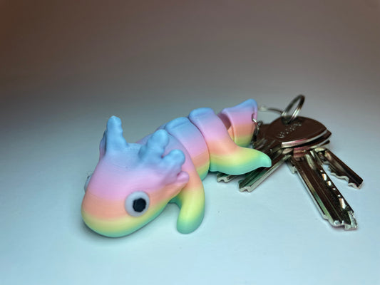 Flexi-Axolotl Stella als Schlüsselanhänger mit Regenbogen-Farbverlauf, 3D-gedruckt