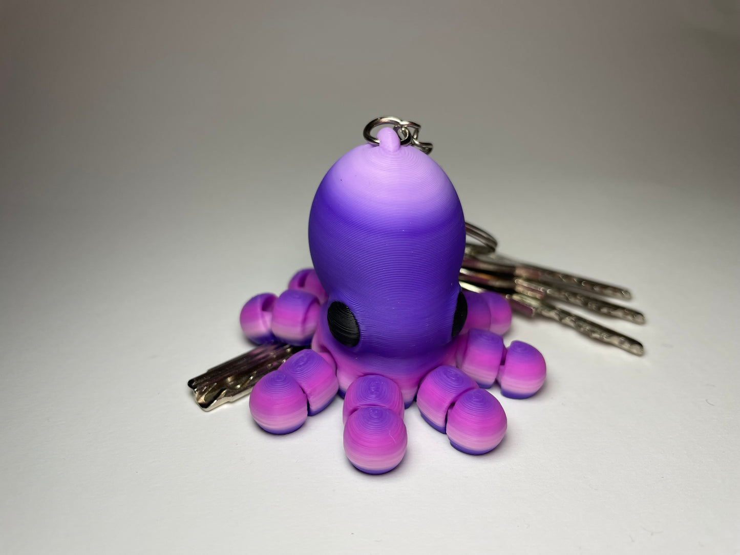 Flexi-Oktopus Jally – Regenbogen PLA Anhänger mit Metallkette