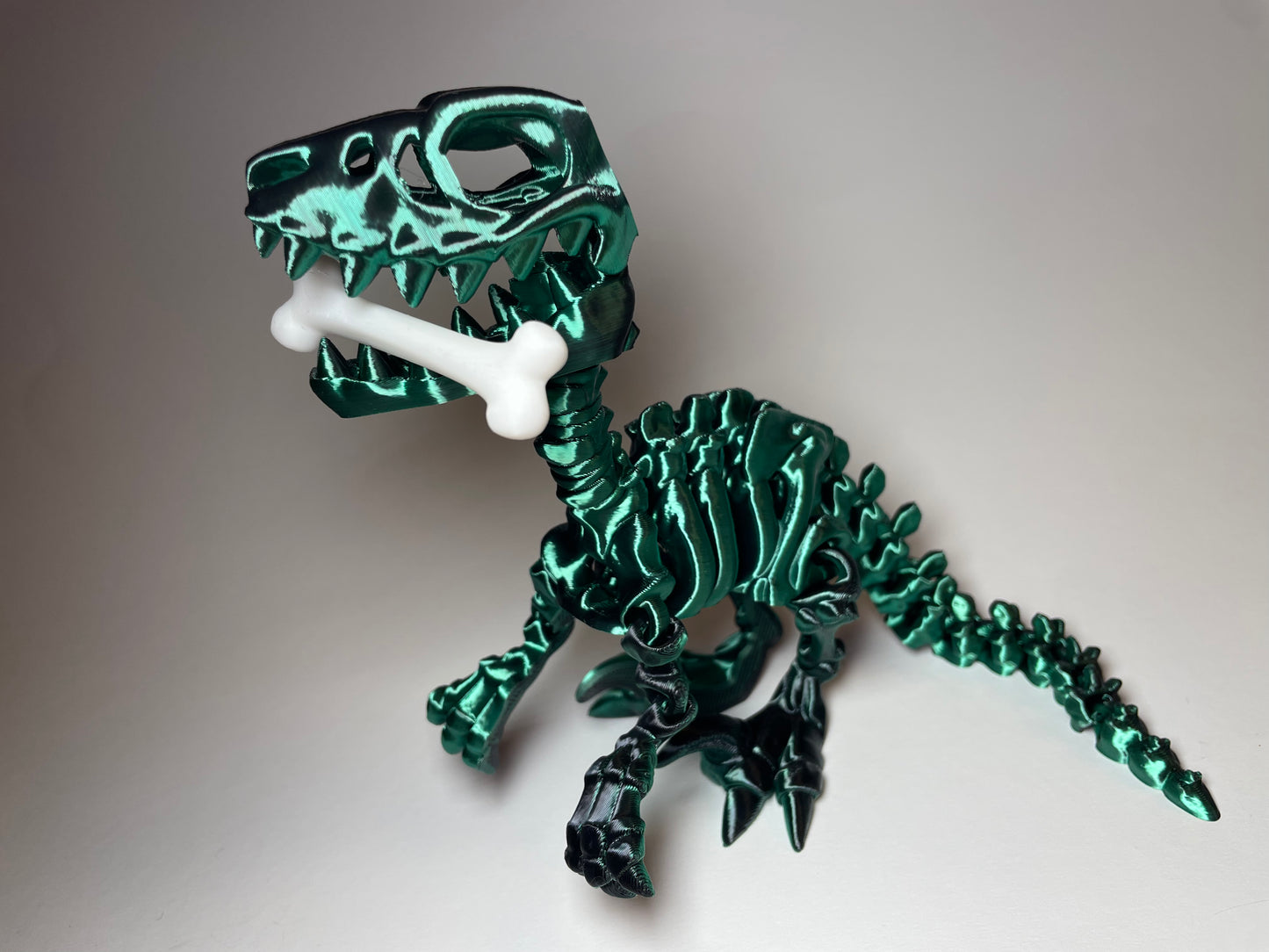 Flexi-Raptor Skelettfigur in Grün-Schwarz