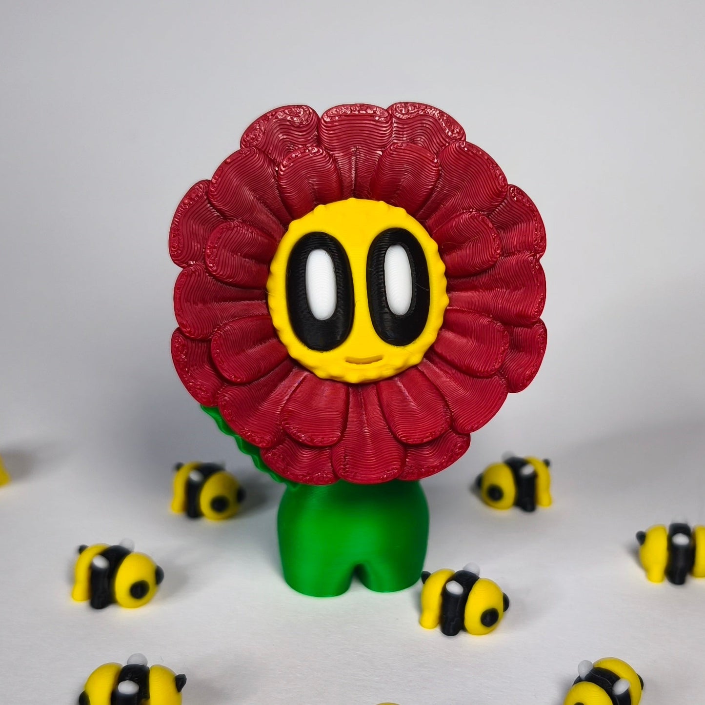 fluffy-3d-druck-blume-mit-gesicht in rot