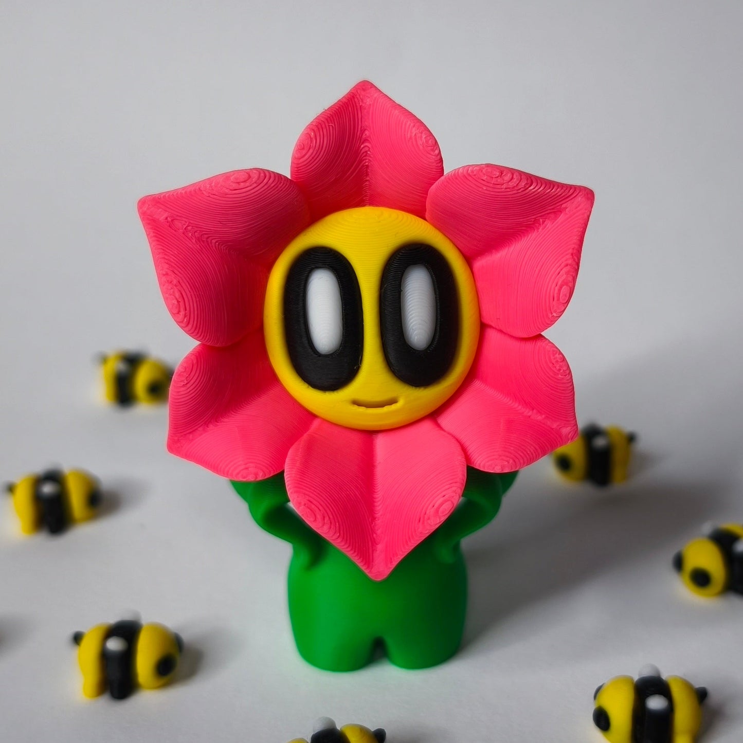 Rosa 3D-gedruckte sternförmige Blume ‚Sternchen‘ mit Gesicht als Dekofigur in verschiedenen Farben