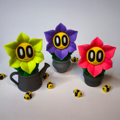 3D-gedruckte  Blumen mit Gesicht als Dekofigur in verschiedenen Farben