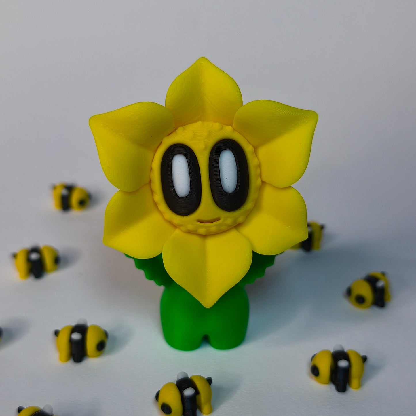 Gelb 3D-gedruckte sternförmige Blume ‚Sternchen‘ mit Gesicht als Dekofigur in verschiedenen Farben