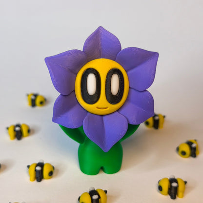 Lila 3D-gedruckte sternförmige Blume ‚Sternchen‘ mit Gesicht als Dekofigur in verschiedenen Farben