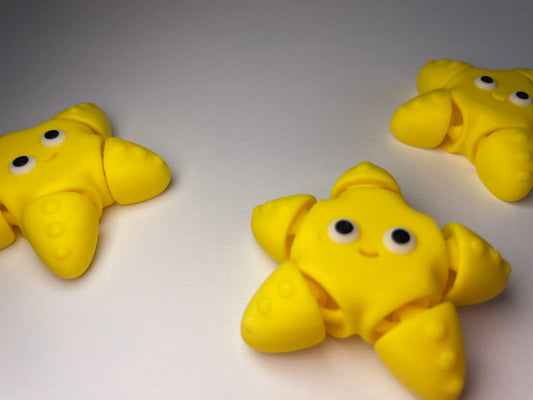Beweglicher 3D-gedruckter Seestern in Gelb als Schlüsselanhänger